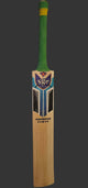 Wooden cricket bat with green handle on a white surface